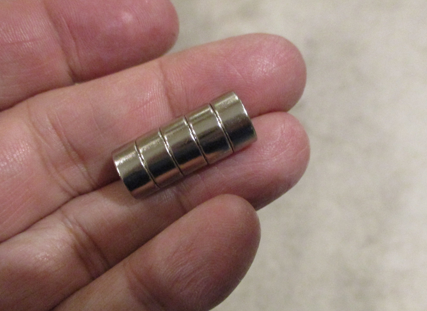 Neodymium Rare Earth Disc Magnet 10mm x 5mm Nickel Coated Grade N52-Multiple Magnets Shown For Illustrative Purposes